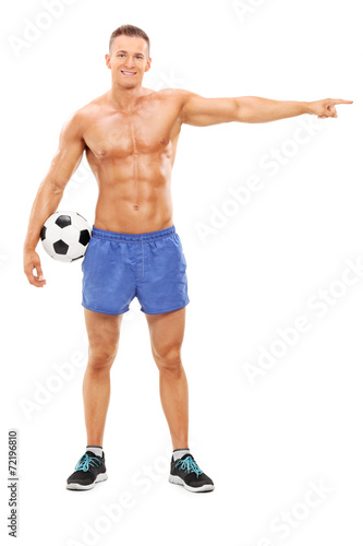Shirtless football player pointing with hand