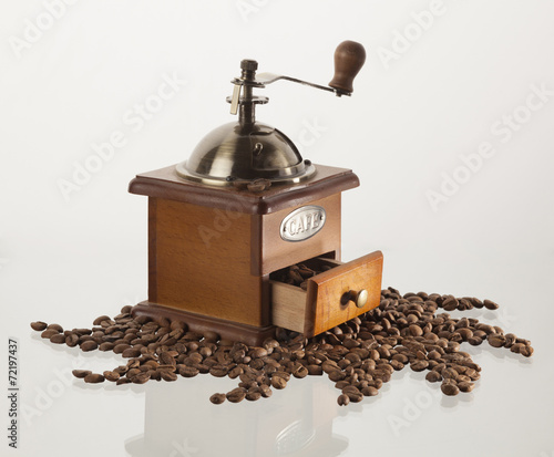 coffee grinder with coffee beans, isolated on white background photo