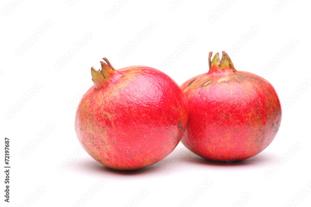 Studio shot of two pomegranates Studio shot of two pomegranates