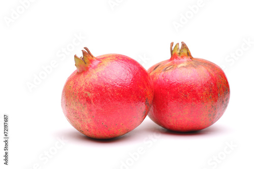 Studio shot of two pomegranates