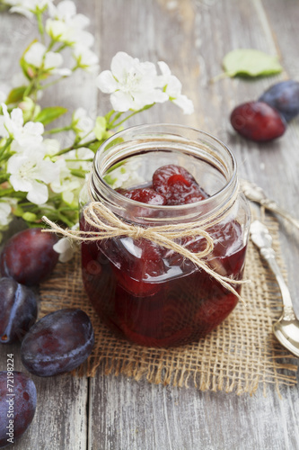 Plum jam in a glass jar