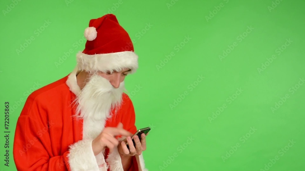 green screen - Santa Claus writes on mobile phone green screen - Santa Claus writes on mobile phone