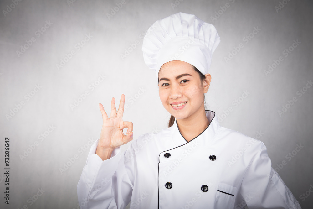 young woman chef showing ok young woman chef showing ok