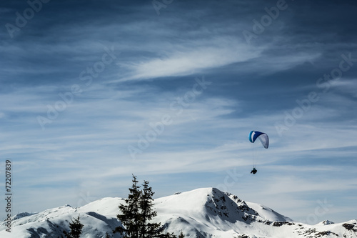 Beautiful mountain view with paraglider