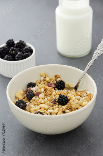 Cereal bowl, milk bottle and blackberries