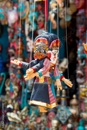 Masks, dolls and souvenirs in street shop in Kathmandu, Nepal.