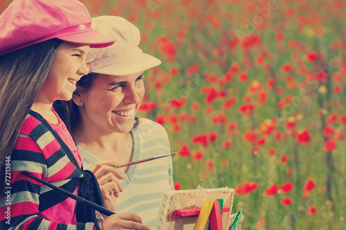Foto Vintage family on the poppy meadow