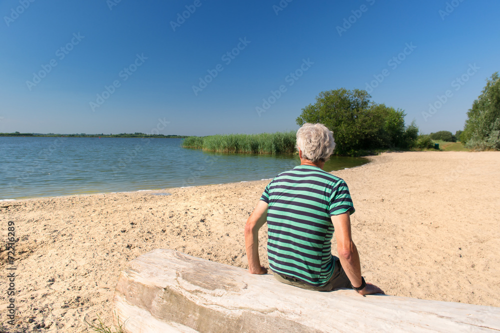 Man in landscape with river