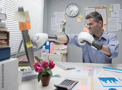 Фотография Office worker punching computer