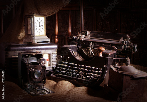 Old typewriter, retro camera and radio receiver
