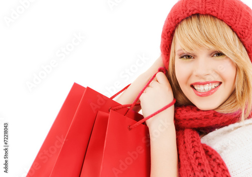 smiling young woman with shopping bags