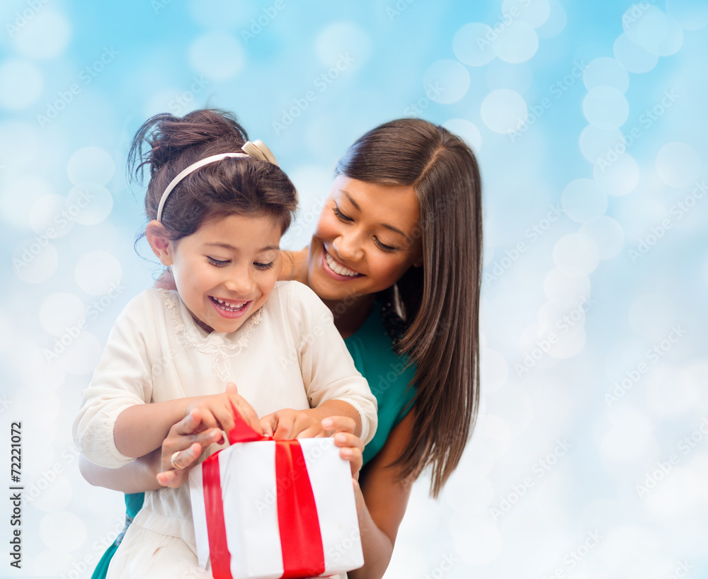 happy mother and little girl with gift box