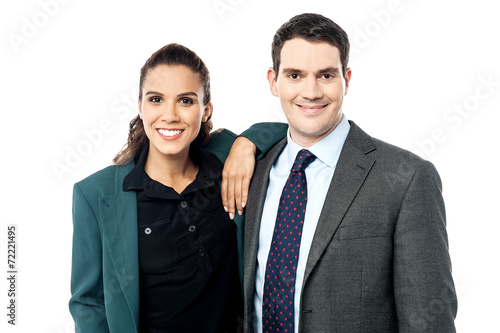 Smiling business couple posing together