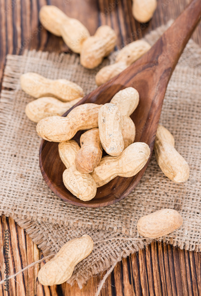 Some Peanuts on a wooden spoon Some Peanuts on a wooden spoon