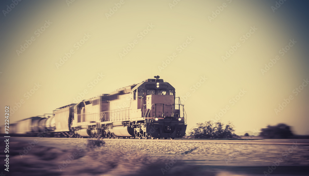 Fototapeta premium Freight train traveling through desert Arizona