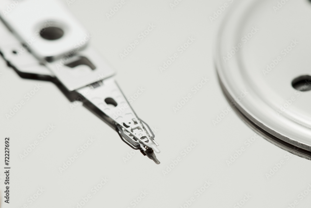 Inside of open and corrupted HDD hard drive disk, narrow focus Inside of open and corrupted HDD hard drive disk, narrow focus