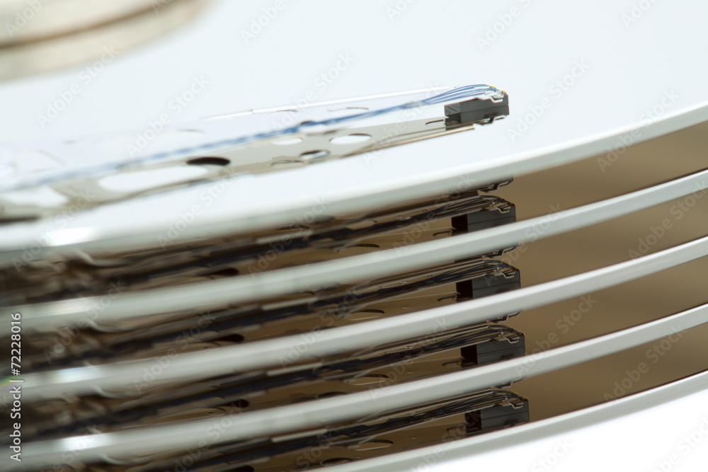Inside of open and corrupted HDD hard drive disk, narrow focus Inside of open and corrupted HDD hard drive disk, narrow focus