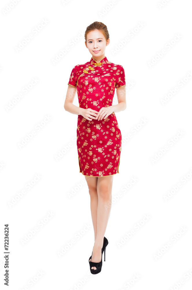 smiling young woman making a elegant pose with cheongsam