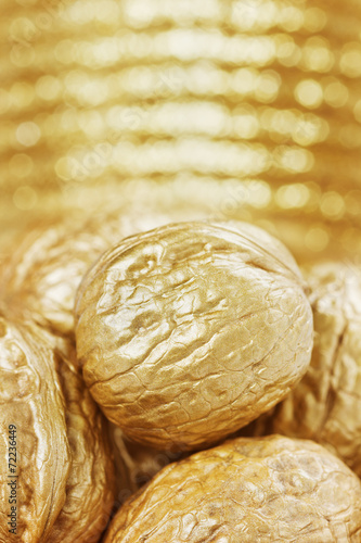 golden walnuts against bokeh background photo