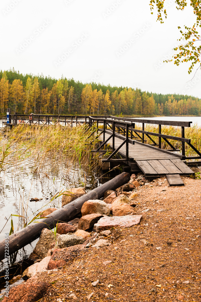 Fototapeta premium Ferry on lake in autumn