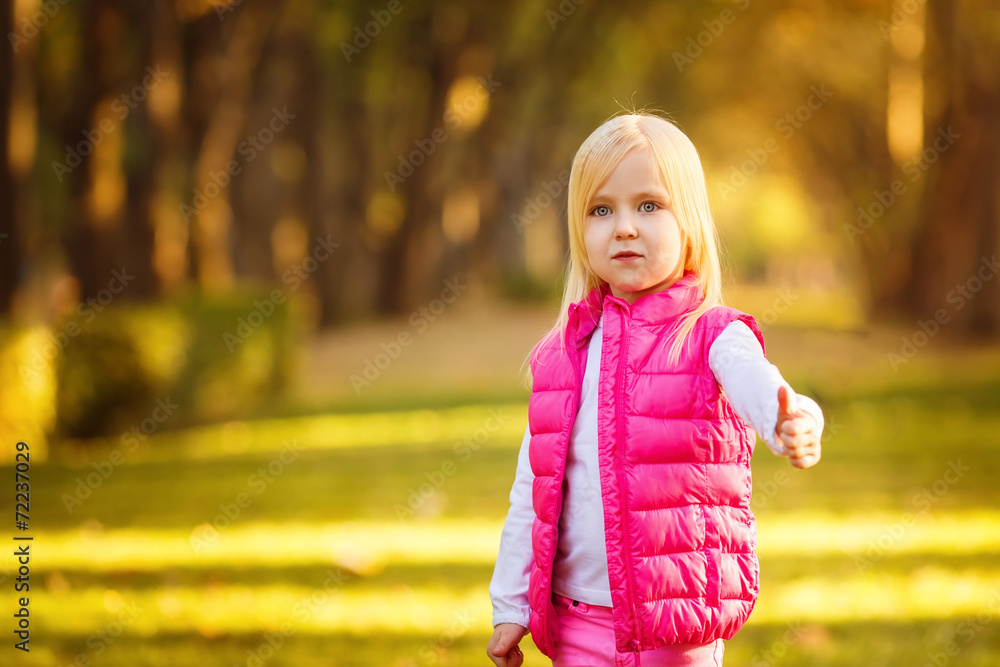 Beautiful girl blowing soap bubbles in the park Beautiful girl blowing soap bubbles in the park