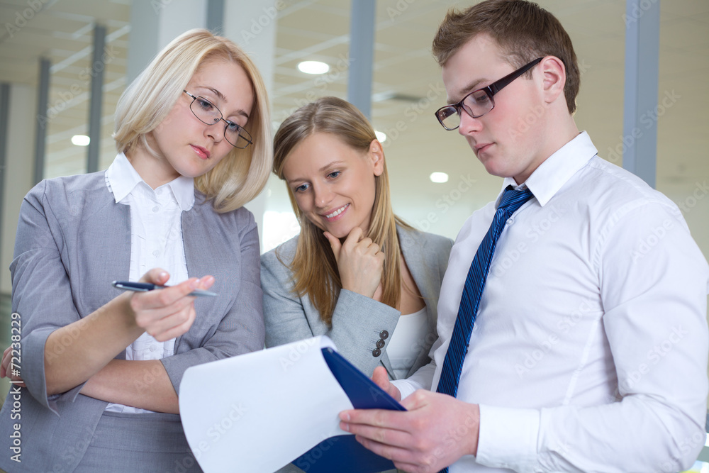 Contemporary business people working in team in the office Contemporary business people working in team in the office