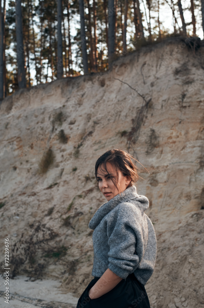 brunette on sea coast in autumn