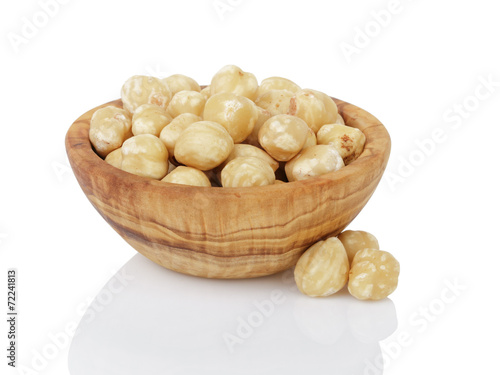 peeled and cleaned hazelnut kernels in wood bowl