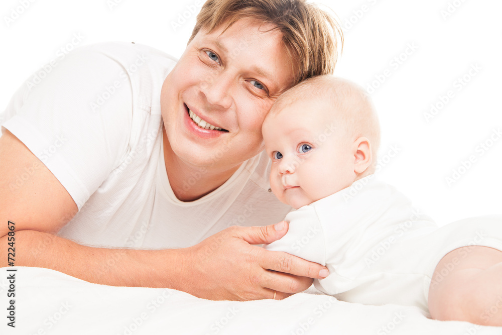 Young Caucasian father playing with baby son Young Caucasian father playing with baby son