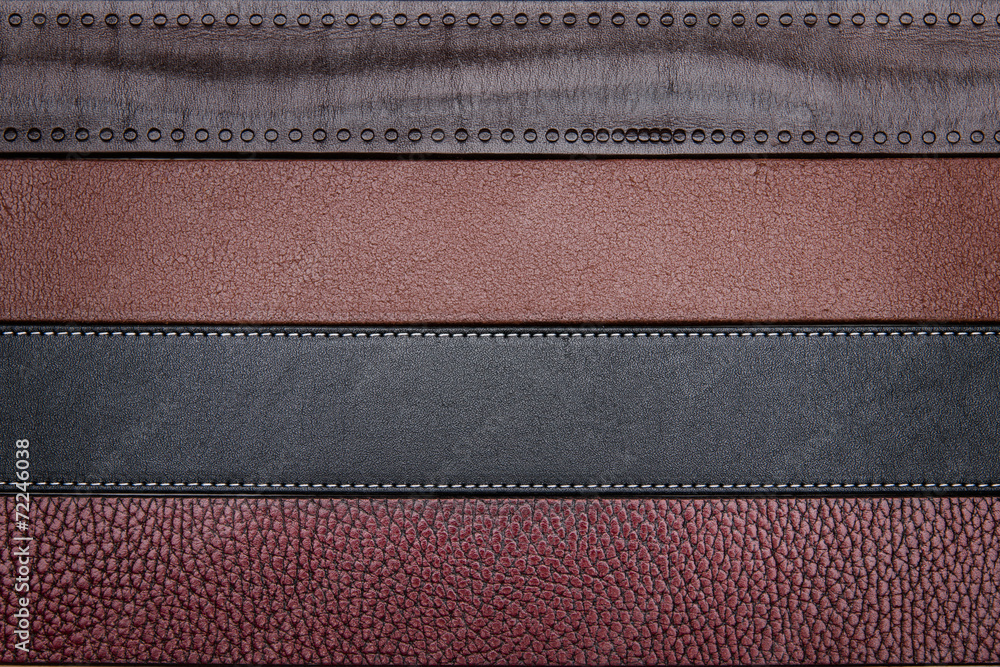 Dark leather belts close-up texture background Dark leather belts close-up texture background