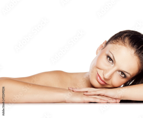head shot of beautiful young woman  lying on white background