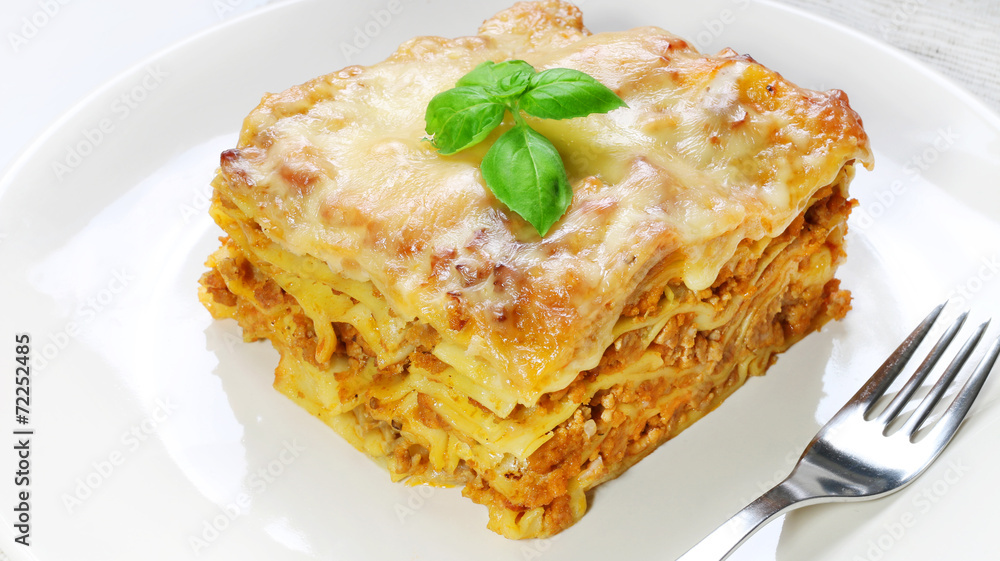 Lasagne with basil on white