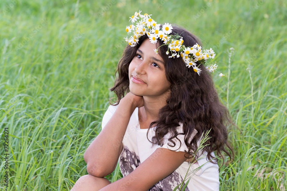 teenage girl with a wreath of daisies on the nature teenage girl with a wreath of daisies on the nature