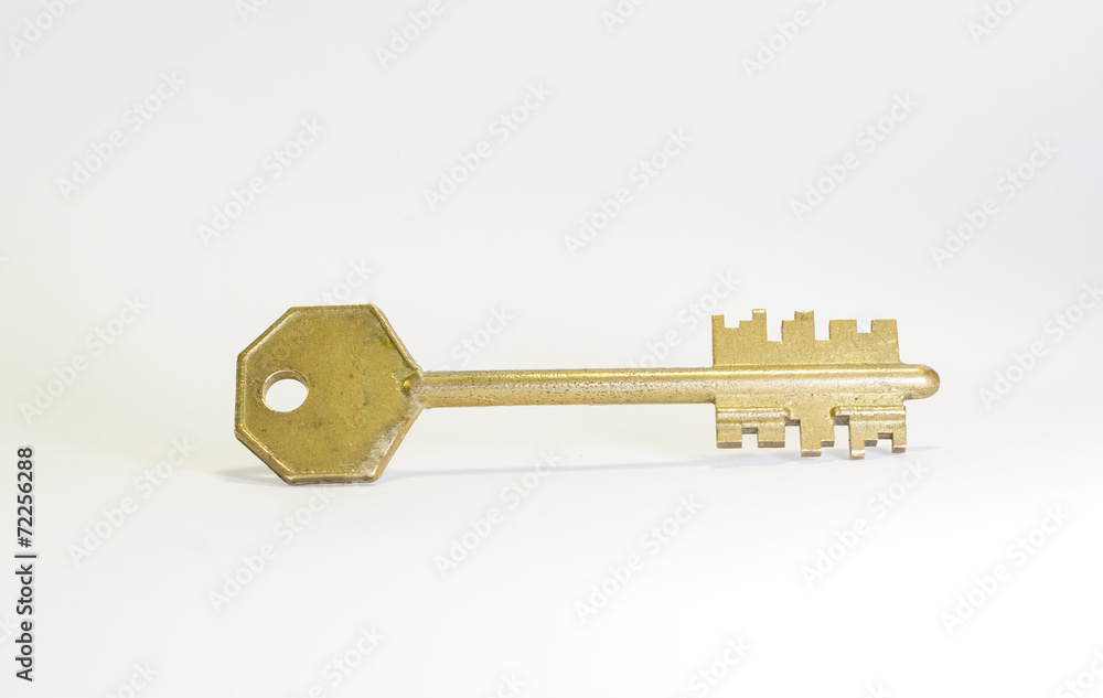Golden key isolated on white background