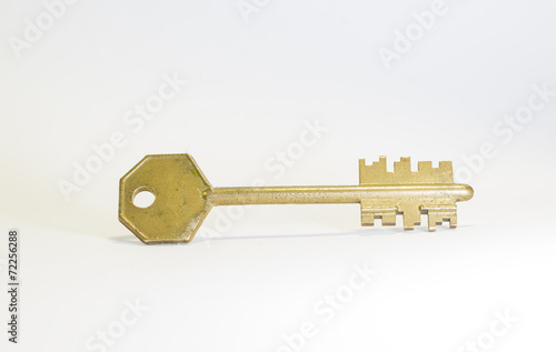 Golden key isolated on white background