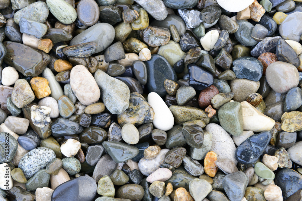 Composition of multicolored sea pebbles background Composition of multicolored sea pebbles background