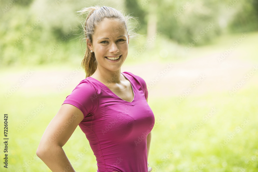 Fit Woman in Red Violet Shirt Looking at Camera Fit Woman in Red Violet Shirt Looking at Camera
