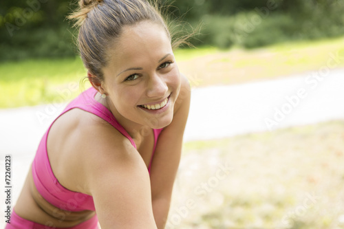 Smiling Young Woman Exercising Outdoor