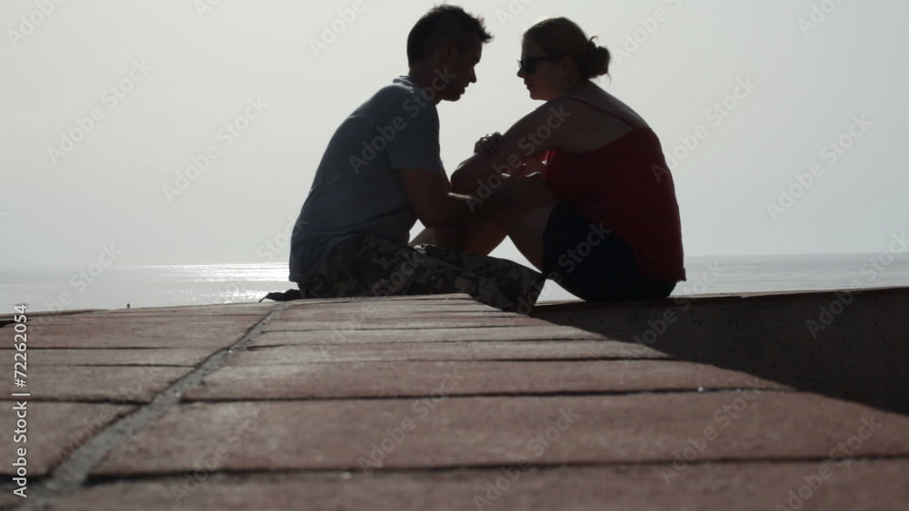 Silhouette of couple in love relaxing outdoors. Silhouette of couple in love relaxing outdoors.