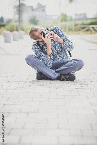 handsome hipster casual multitasking modern man with vintage cam