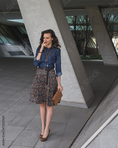 Free Download Pretty girl posing in the city streets - GFXLoad