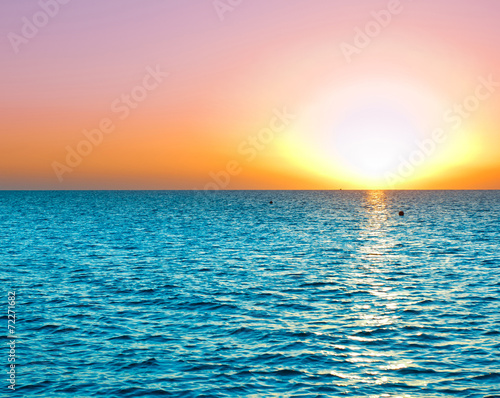 Fototapeta Naklejka Na Ścianę i Meble -  Bright Colorful Sunrise On The Sea With Beautiful Clouds