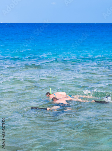 Seascape with a swimmer