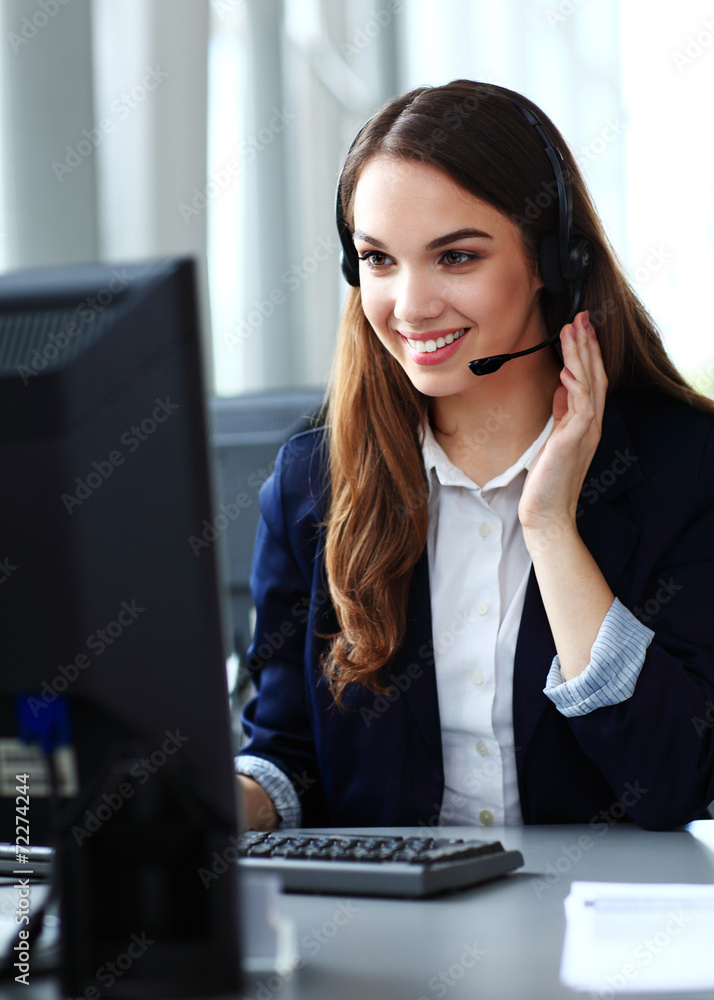© opolja - Female customer support operator with headset and smiling © opolja - Female customer support operator with headset and smiling