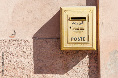 Yellow letter box of the moroccan post in Marrakesh, Morocco photo