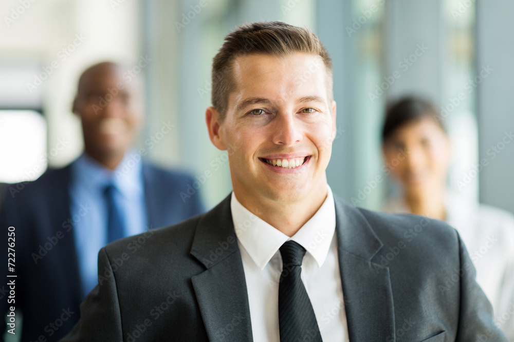 businessman with colleagues on background businessman with colleagues on background
