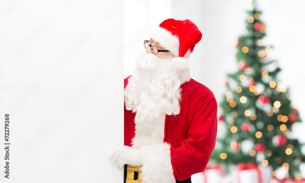 man in costume of santa claus with billboard man in costume of santa claus with billboard