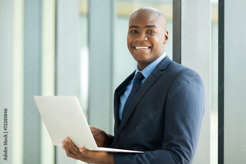young african businessman using laptop computer