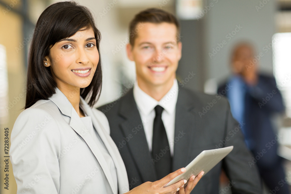 young indian businesswoman with co-worker young indian businesswoman with co-worker