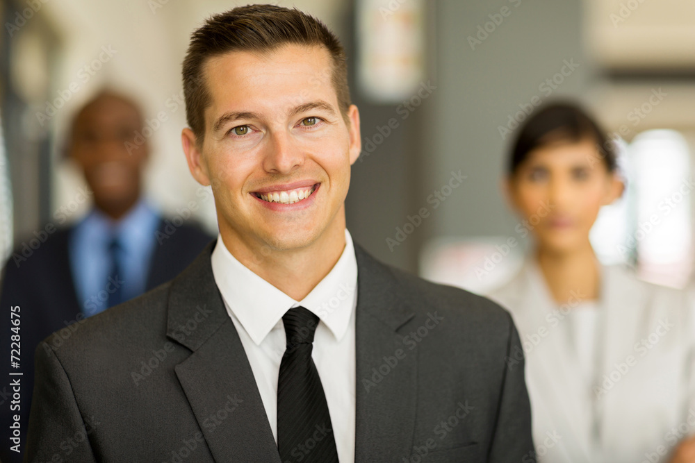 young business man with colleagues on background young business man with colleagues on background